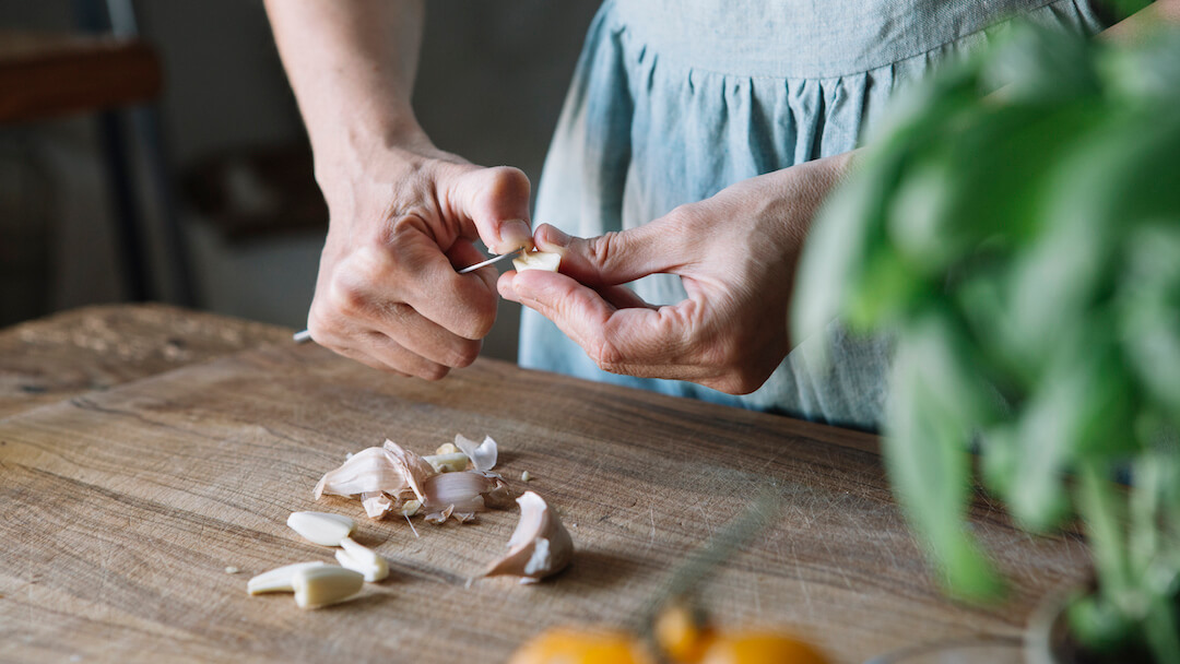 Woman peeling garlic